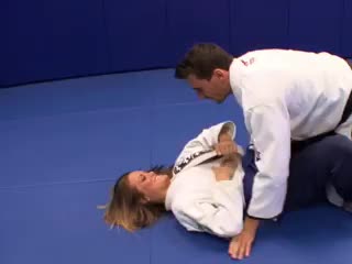 Judo teacher demonstrates a new hold