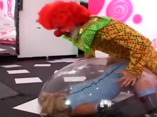 Enthusiastic clown fucks blonde latex slut in her ass